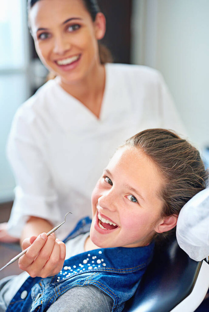 I brush three times a day. Portrait of a young girl have a checkup at the dentist - Foto, Imagem
