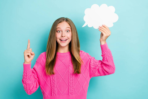 Photo of smart nerd schoolgirl wear pink knitted sweater finger up eureka genius idea hold white paper cloud mockup isolated on blue color background. - Φωτογραφία, εικόνα