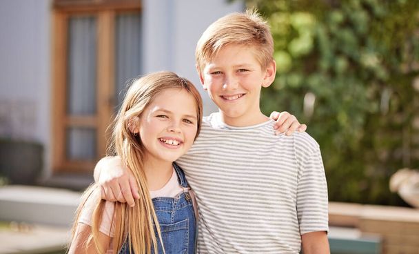 Children, smile and siblings or friends hug outdoor with happiness bonding. Portrait of a girl and kid in summer happy about friendship, love and vacation in the sun together with relax feeling. - Photo, Image