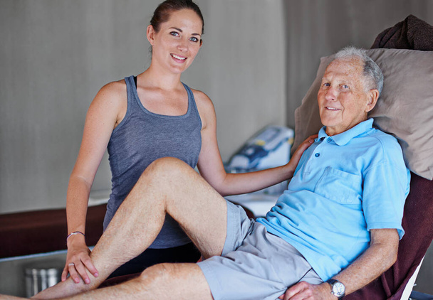 Getting my patients back on their feet. Portrait of an elderly man having a physiotherapy session with a female therapist - Foto, Imagen