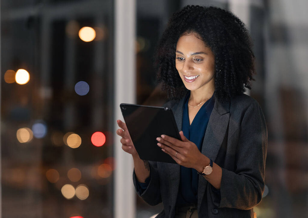 Night business, black woman and tablet for communication, marketing and data analytics online with smile for success, achievement and benchmarking results. Entrepreneur with technology for innovation. - Foto, imagen