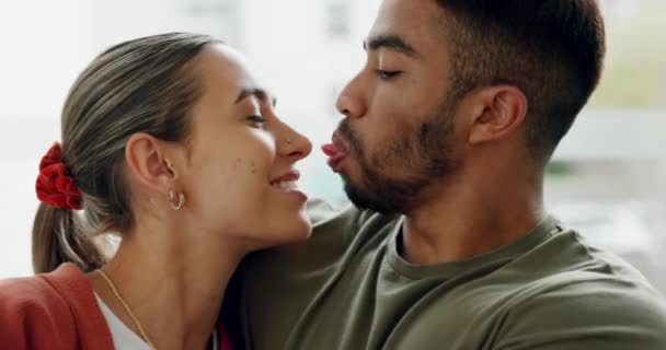 Interracial couple, bonding and laughing in house, home or hotel living room in playful, fun or love trust. Smile, happy or relax man and woman in hug, embrace or support partnership or relationship. - Footage, Video
