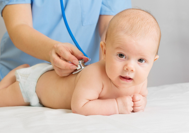 Doctor with stethoscope listen baby - Φωτογραφία, εικόνα