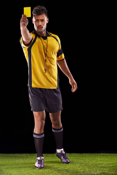 One more warning and youre off. a referee against a black background - Valokuva, kuva