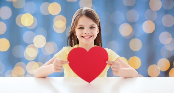 smiling little girl with red heart - Foto, Imagem