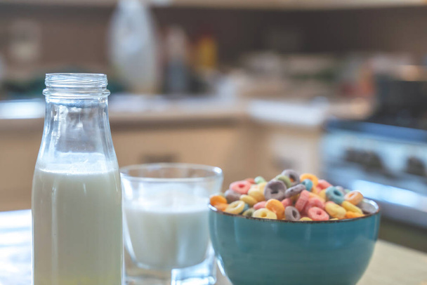 Bowl of colorful children's cereal and milk isolated on wood table with Text space - Foto, Imagen
