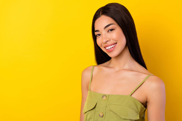 Portrait of cute positive thai person beaming smile empty space blank isolated on yellow color background. - Fotoğraf, Görsel