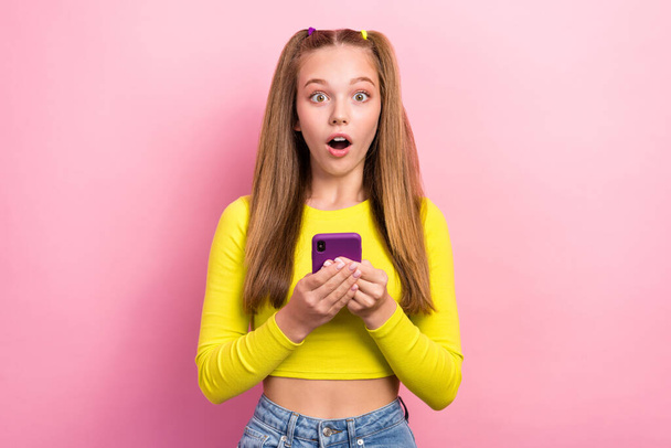 Photo of speechless user blogger stylish outfit impressed function modern gadget 5g connection network isolated on pink color background. - Foto, Imagem