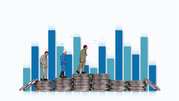 Miniature old men standing on a pile of coins. Business concept with piles of coins and bar graphs. - Footage, Video