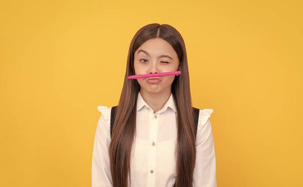 Knowledge day. Winking girl hold pen as mustache. School education. Knowledge day. September 1. Learning fun. - Foto, Imagem