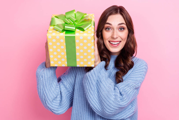 Portrait of funny cheerful girl hands hold receive giftbox toothy smile isolated on pink color background. - Φωτογραφία, εικόνα