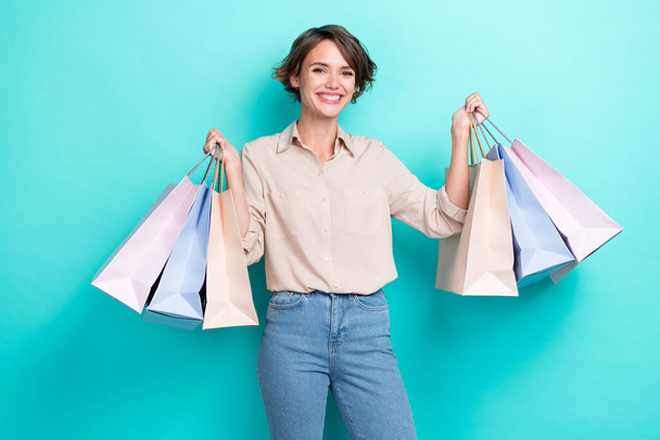 Photo of cheerful positive lady wear stylish outfit rejoice new wardrobe low price comfort autumn clothes isolated on cyan color background. - 写真・画像