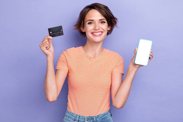 Photo of cheerful lady businesswoman bank client satisfied functions modern device ecommerce transaction isolated purple color background. - Foto, Imagen