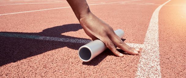 Stadium start track, athlete hands and relay ready for runner competition, sports race and fitness exercise. Marathon training, asphalt wellness workout and woman hand with baton for running match. - Foto, imagen