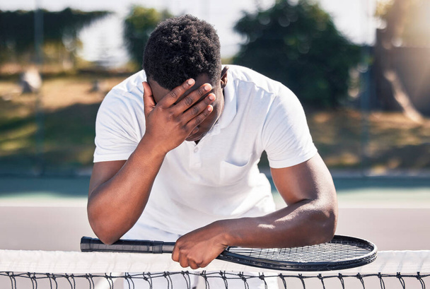 Loser, tennis and black man fitness, for game and losing with headache outdoor on court. Mental health, African American male and athlete with stress, workout and bad training after frustrated match - Photo, Image