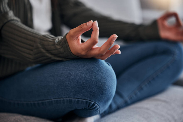 Meditation, lotus hands and woman with zen and yoga at home, mindfulness and chakra balance for positive energy and wellness. Meditate on sofa, spiritual and peace, calm stress relief and healing - Fotografie, Obrázek
