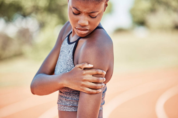 Arm injury, fitness and black woman runner after training, exercise and running accident outdoor. Muscle pain, sports bruise and workout inflammation after sports on a outdoor run field of an athlete. - Foto, Imagem