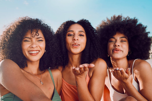 Black woman, friends and selfie blowing kiss for happy friendship, summer vacation and bonding in the outdoors. Portrait of African American women enjoying social fun for photo moments together. - Φωτογραφία, εικόνα