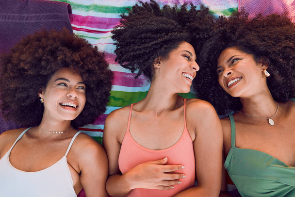 African women, happy and friends on floor for support, love and care or bonding together at beach. Black girls, smile and friendship happiness, laughing with afro and fun on summer holiday. - Fotoğraf, Görsel