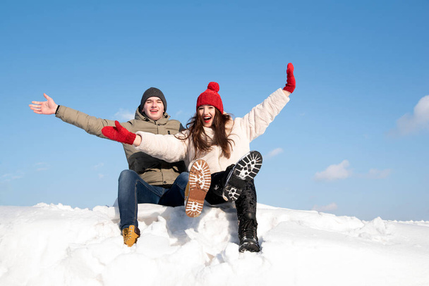 Young couple have fun on sunny winter day. Winter holidays. Lot of snow - Fotografie, Obrázek