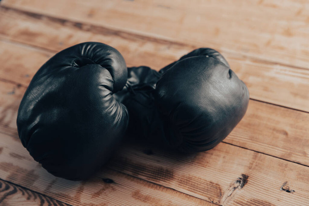 Boxing gloves on a wooden tabl - Photo, Image