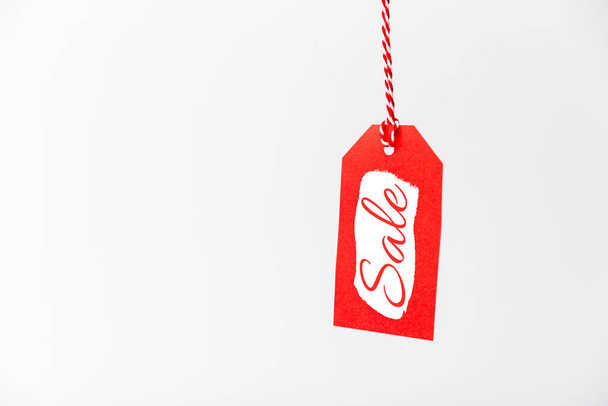 Black friday sale. Red price tag with sale sticker isolated on white background - Foto, imagen
