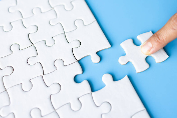 Jigsaw puzzle with missing piece. Completing final task, missing jigsaw puzzle pieces and business concept with a puzzle piece missing. - Foto, imagen