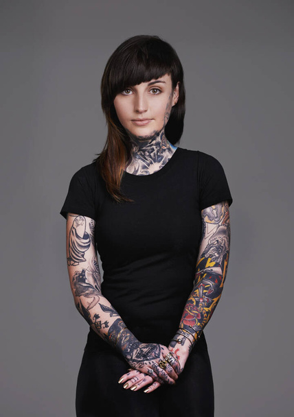 I collect memories on my skin. A cropped studio portrait of a beautiful tattooed young woman - Photo, Image