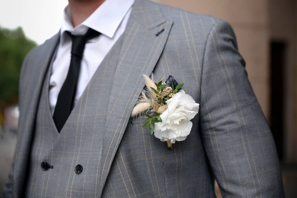 Miscellaneous wedding details. Boutonniere, corset, flowers and more - Фото, изображение