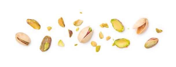 Pistachio nuts with shell and chopped pistachios isolated on white background - Photo, Image