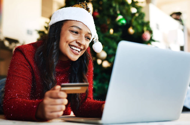 Woman, laptop and credit card in ecommerce for Christmas gift or online shopping with smile at home. Happy female banking online or shopping on computer for present during joyful festive season. - Zdjęcie, obraz