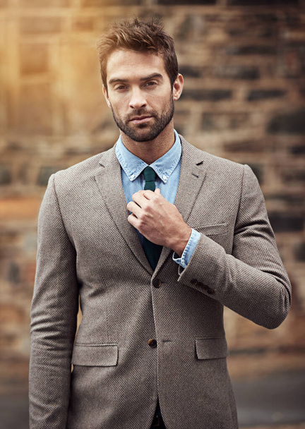 Styleits serious business. a handsome and stylish young businessman in an urban setting - Foto, Imagem