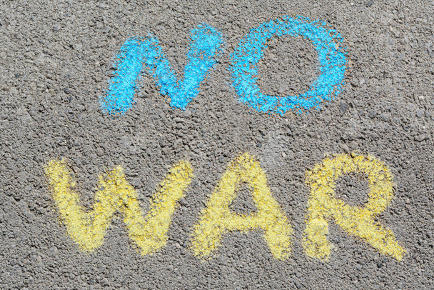 Words No War written with blue and yellow chalks on asphalt outdoors, top view - Fotó, kép