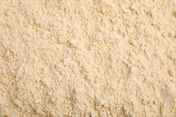 Closeup of chickpea flour as background, top view - Φωτογραφία, εικόνα