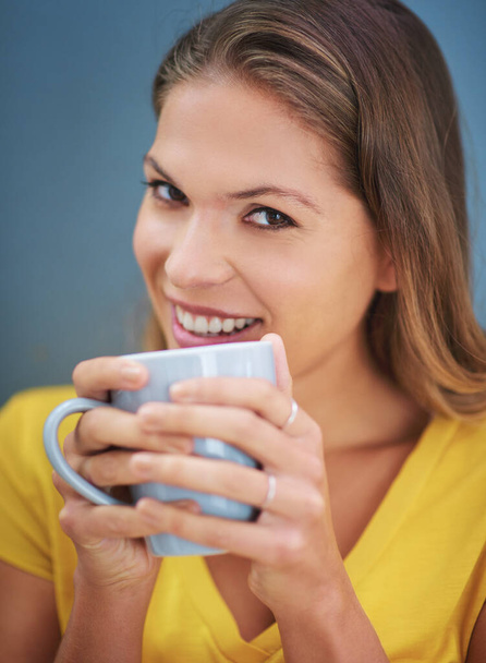Happy woman, studio and coffee or tea for morning motivation, happiness and inspiration with hot drink for energy, relax and break. Portrait of female in studio while drinking beverage from cup. - Фото, изображение