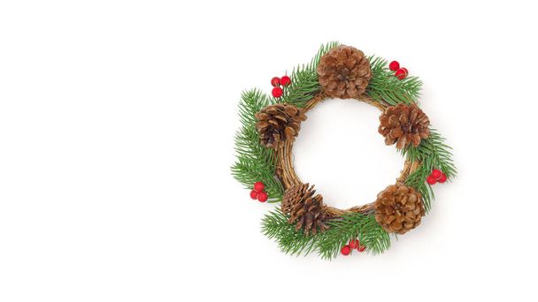 Decorative Christmas wreath on white with copy space - Foto, imagen
