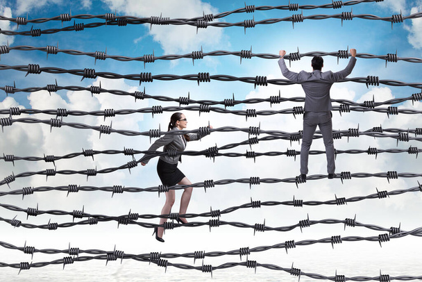 Business people in the barbed wire concept - Photo, Image