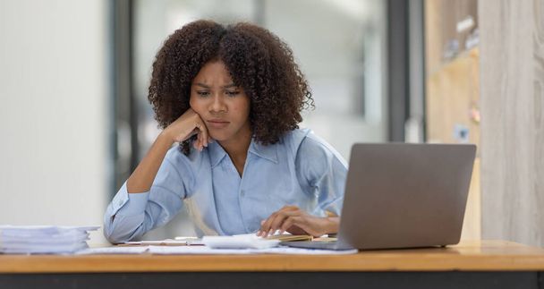african american family stressed while working on laptop, Tired sad woman with headache feeling sick at workplace office copy space.  - Foto, imagen