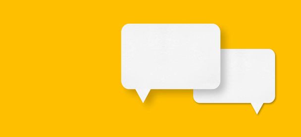speech balloon shape white paper isolated on yellow background Communication bubbles. - Foto, afbeelding