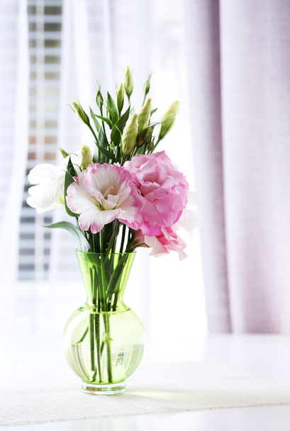 Beautiful flowers in vase with light from window - Zdjęcie, obraz