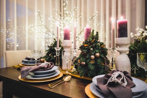 Christmas Eve table decorations, Christmas mood, Christmas tree on the dining table. Defocused. High quality photo - Valokuva, kuva