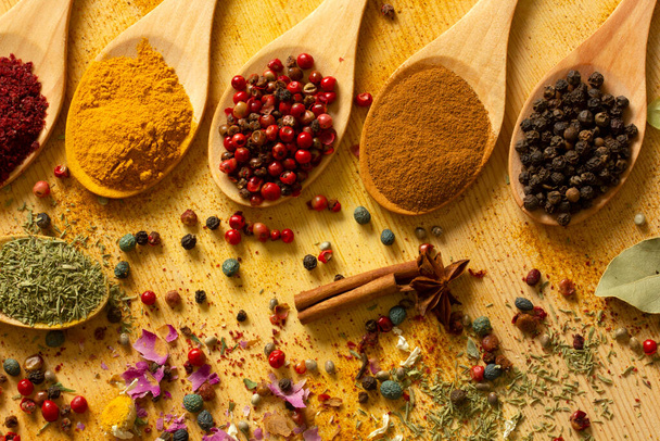 various spices in wooden spoons - Photo, Image