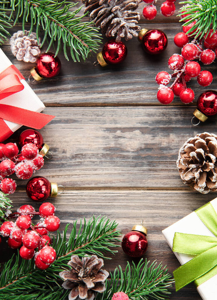 Christmas background with fir tree and decor on old wooden background background. Top view with copy space - Φωτογραφία, εικόνα