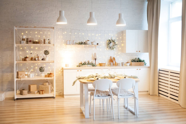 Christmas white interior. Stylish kitchen decorated for New Year holidays - 写真・画像