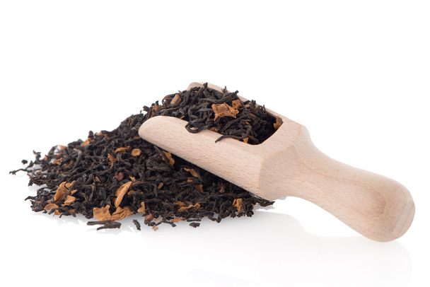Black Dry Tea with a Wooden Spoon - Fotó, kép