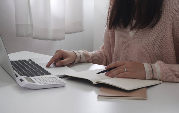 Female remotely working, studying online using laptop computer technology - Photo, Image