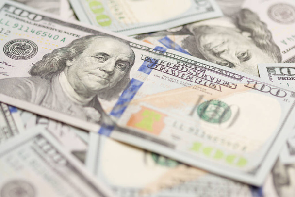 One Hundred Dollar Bills Laying on Flat Surface. - Photo, Image