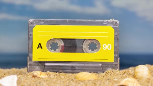 Changing cassette tapes on a beach  - Footage, Video