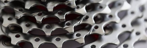 Close-up of bicycle roller chain, part of vehicle that transfer power from pedals to drive. Rear cassette in mountain bike, metal detail. Transport concept - Fotó, kép