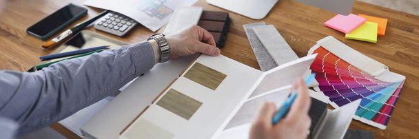 Close-up of interior designer create color mix for new house project, palette on workplace in agency. Samples with options on desk. Creativity, art concept - Fotografie, Obrázek
